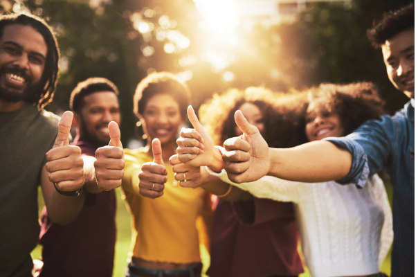 Group of people giving thumbs up